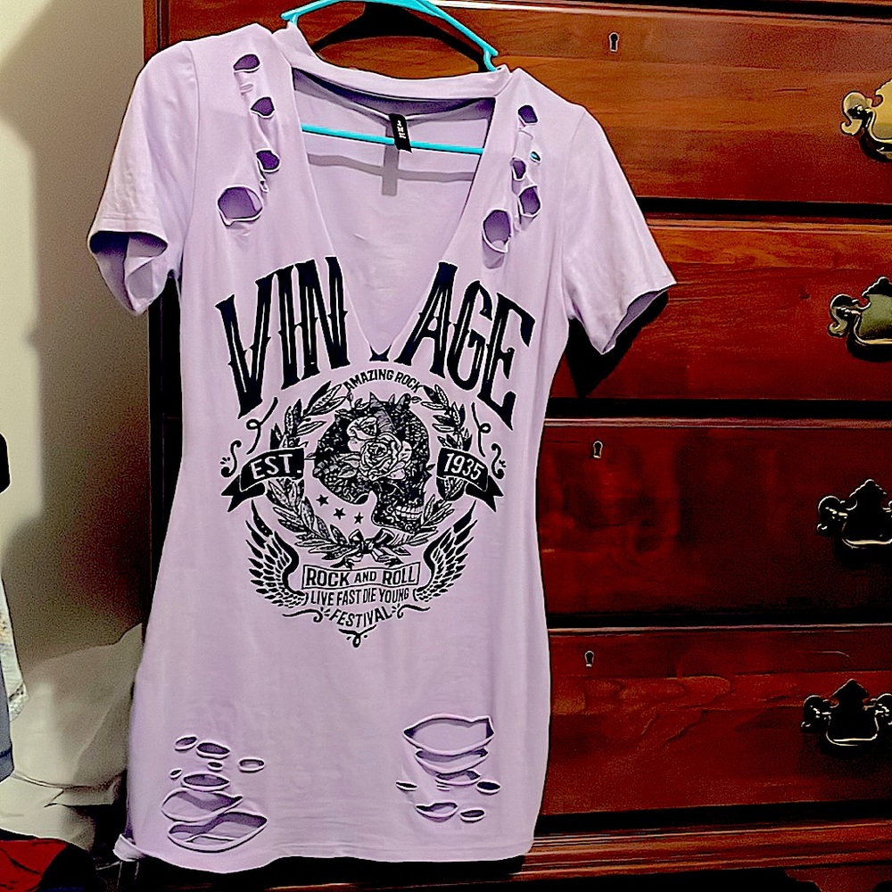 Punk Rock T-shirt dress. This top is edgy and unique with tattered accents.